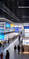 Modern trade show exhibition hall with branded booths